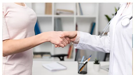 Doctor and patient shaking hands